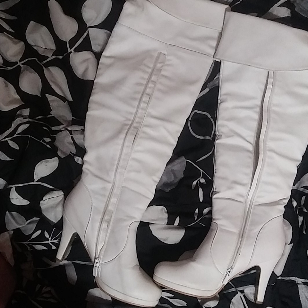 White heeled knee high boots